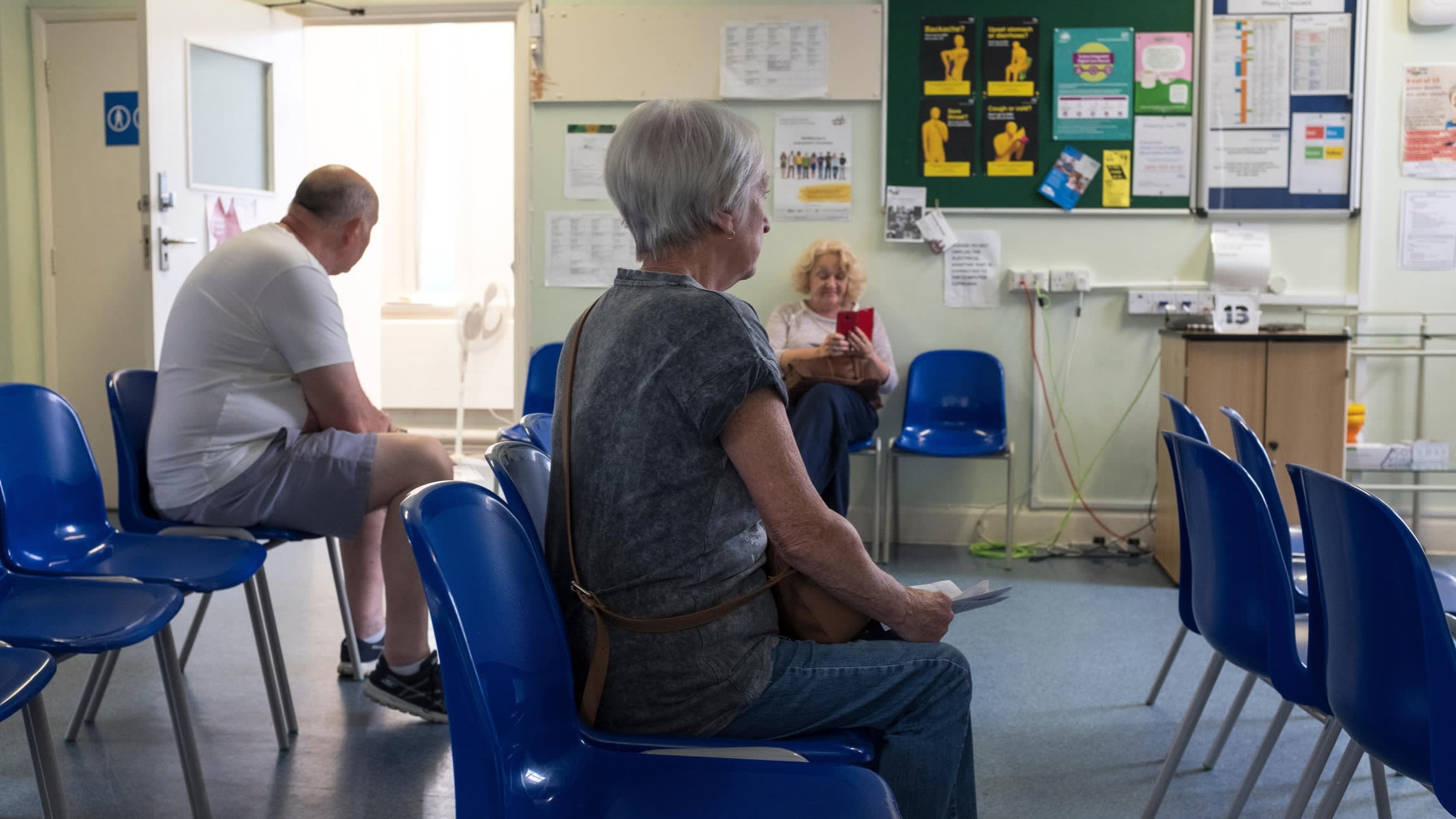 Patients wait to be seen by a GP. The system needs reform not because the NHS is flawed but because its aspiration is to deliver high-quality care for all